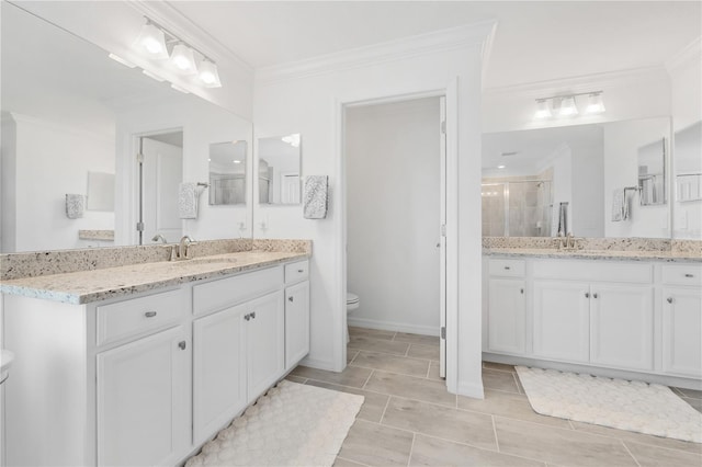 bathroom featuring vanity, a shower with door, crown molding, tile patterned flooring, and toilet