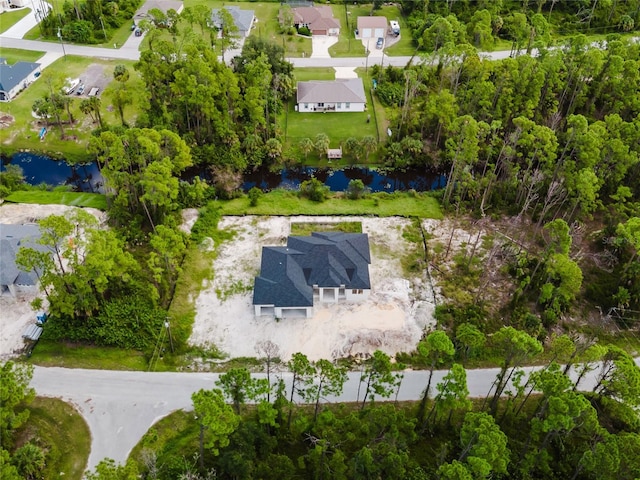 bird's eye view with a water view