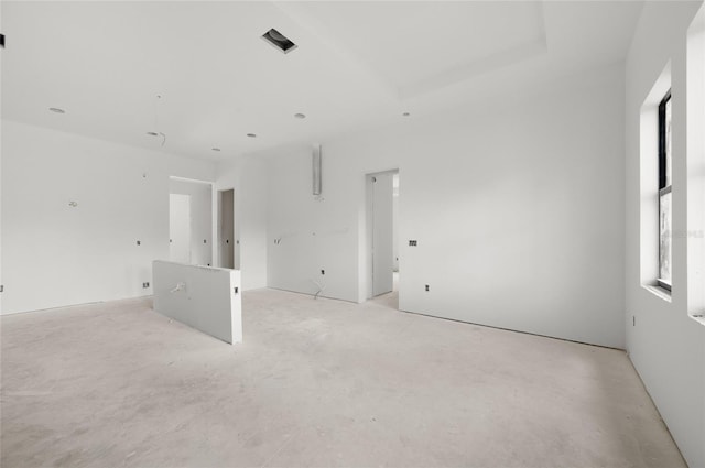 2502 Pinewood St, North Port, FL 34288 - empty room with concrete floors and a raised ceiling
