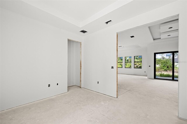 2502 Pinewood St, North Port, FL 34288 - empty room featuring a tray ceiling