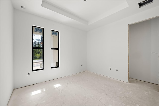 empty room with a tray ceiling