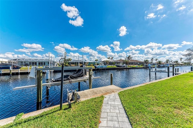 dock area featuring a yard and a water view