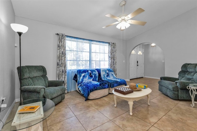 tiled living room featuring ceiling fan