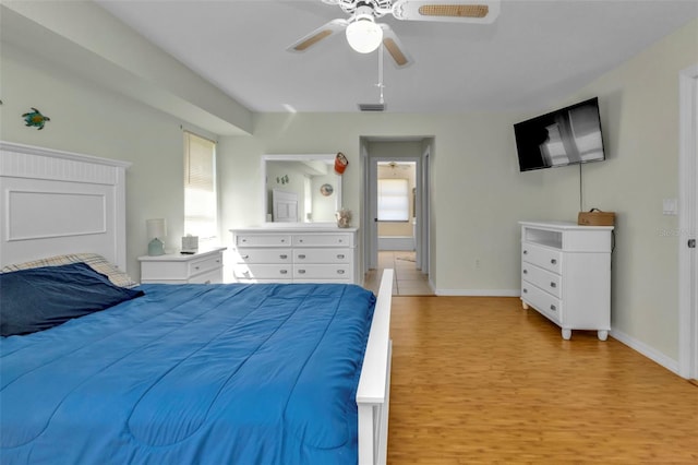 bedroom with light wood-type flooring and ceiling fan