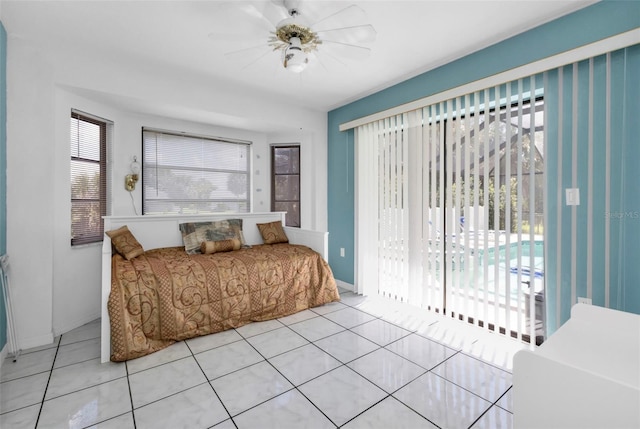 tiled bedroom with ceiling fan and access to outside