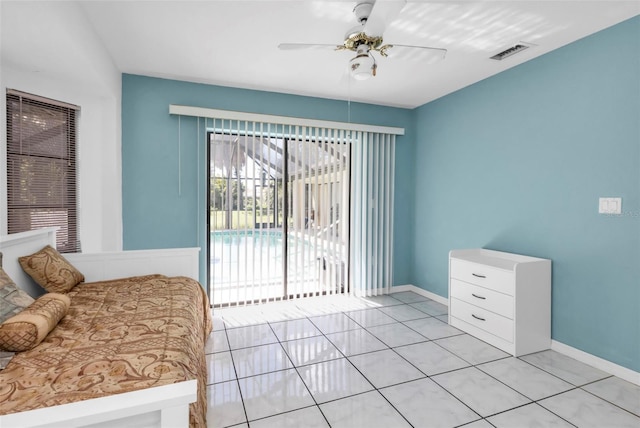 bedroom featuring access to outside, light tile patterned floors, and ceiling fan