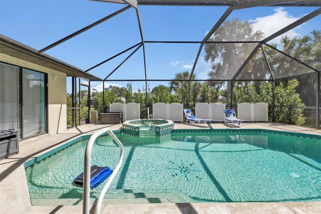 view of pool featuring a patio, glass enclosure, and an in ground hot tub