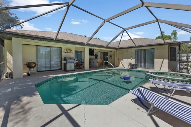 view of swimming pool featuring a lanai, a patio, and a grill