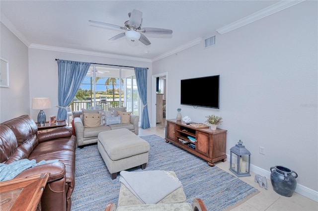 tiled living room with ornamental molding and ceiling fan