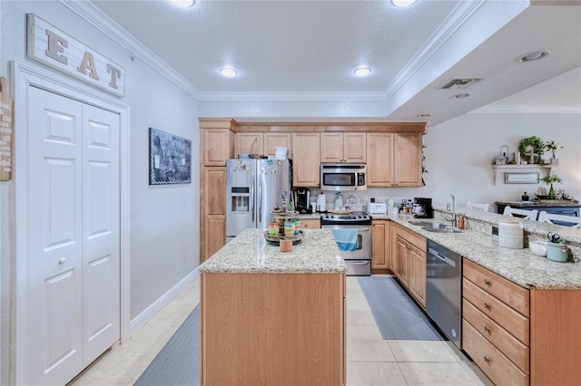 kitchen with ornamental molding, sink, kitchen peninsula, appliances with stainless steel finishes, and light stone countertops