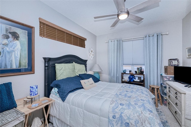 bedroom with ceiling fan and light carpet