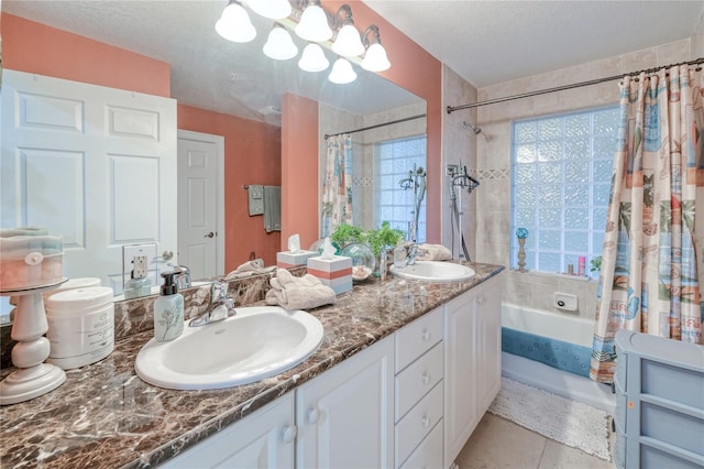 bathroom with vanity, tile patterned floors, a textured ceiling, and shower / tub combo with curtain