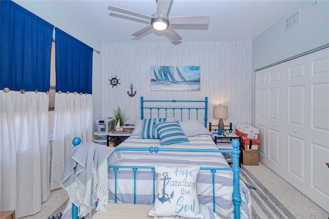 bedroom featuring ceiling fan and a closet