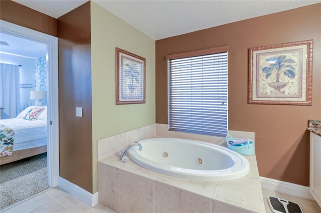 bathroom featuring tile patterned flooring, tiled tub, and a textured ceiling