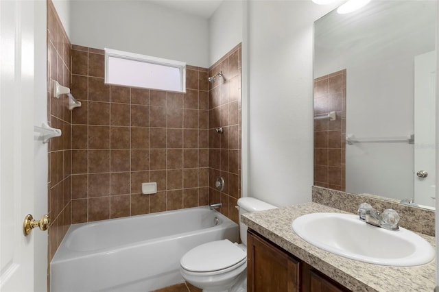 bathroom featuring toilet, washtub / shower combination, and vanity