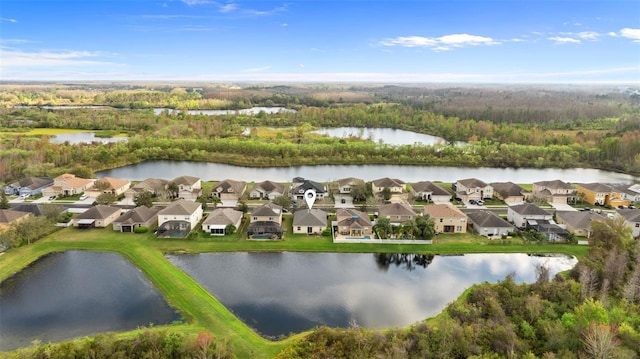 drone / aerial view with a residential view and a water view