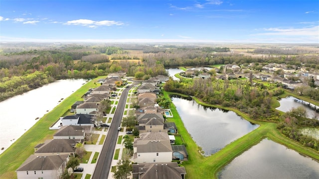 bird's eye view with a water view and a residential view