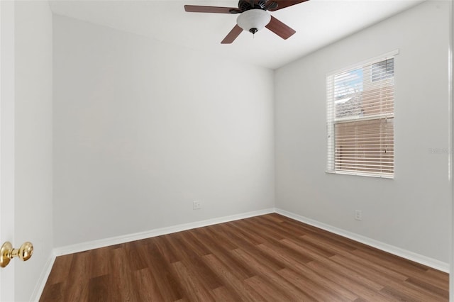 unfurnished room with ceiling fan, baseboards, and wood finished floors