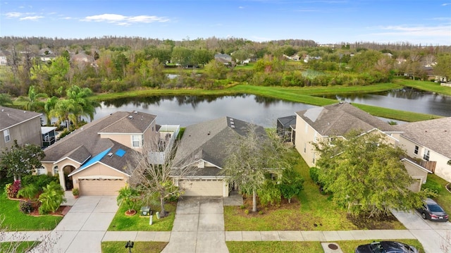 bird's eye view with a water view and a residential view