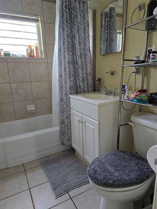 full bathroom featuring tile patterned flooring, shower / bath combination with curtain, vanity, and toilet