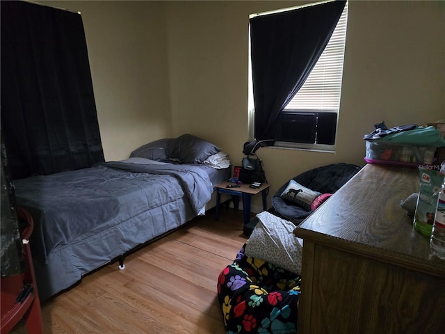 bedroom with light hardwood / wood-style flooring