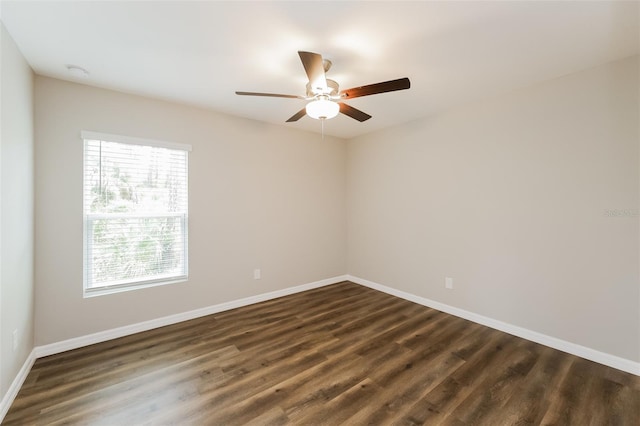 unfurnished room with ceiling fan, dark hardwood / wood-style flooring, and a healthy amount of sunlight