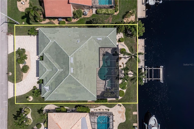 birds eye view of property with a water view