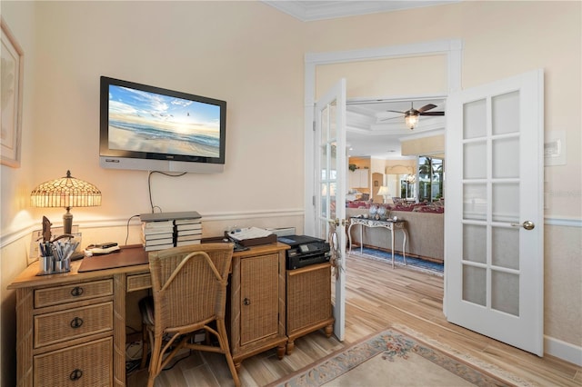 office with french doors, ceiling fan, ornamental molding, and light hardwood / wood-style flooring