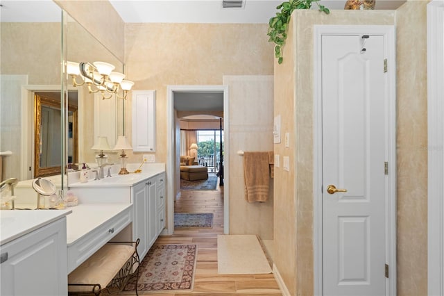 bathroom with vanity and hardwood / wood-style flooring