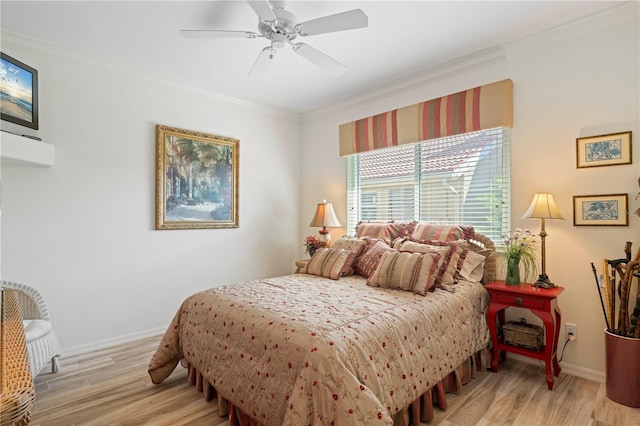 bedroom featuring light hardwood / wood-style flooring, ornamental molding, and ceiling fan