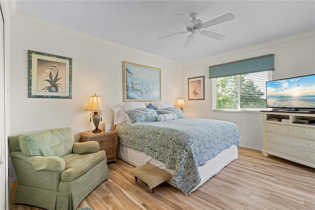 bedroom with light hardwood / wood-style floors, crown molding, and ceiling fan