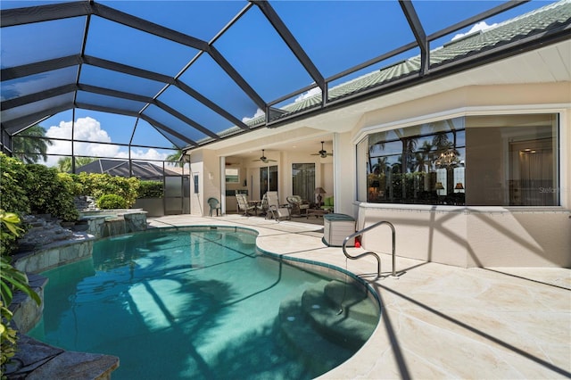 view of pool with a patio, ceiling fan, a lanai, and an in ground hot tub