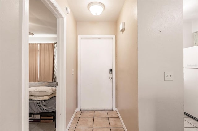 corridor featuring light tile patterned floors