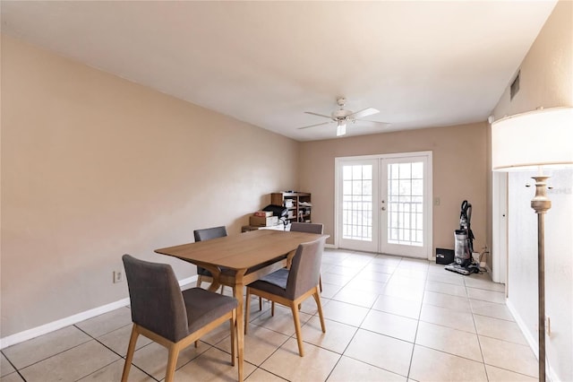 dining room featuring ceiling fan, french doors, and light tile patterned floors