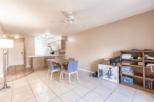 dining space with ceiling fan and light tile patterned floors