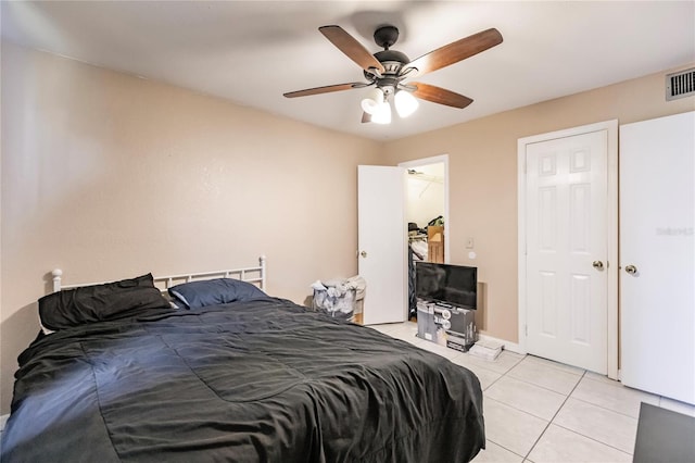 bedroom featuring ceiling fan and light tile patterned floors