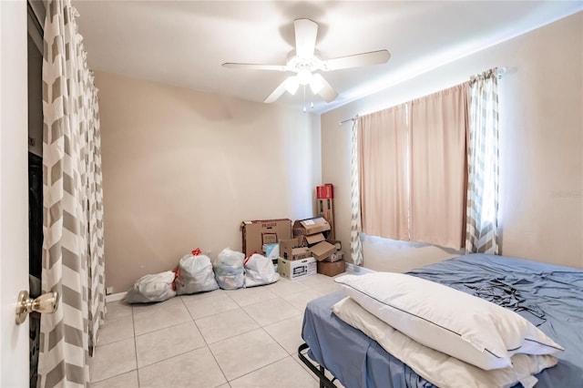 bedroom featuring ceiling fan and light tile patterned floors