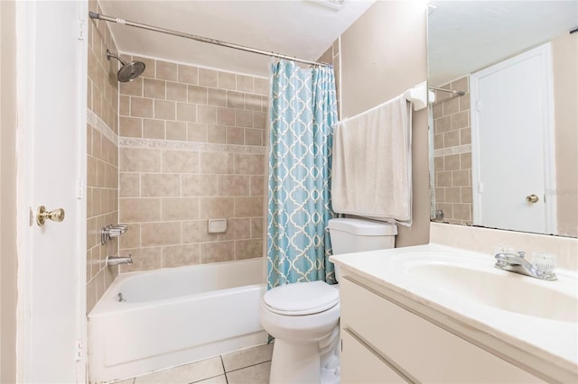 full bathroom featuring shower / bath combination with curtain, tile patterned floors, vanity, and toilet