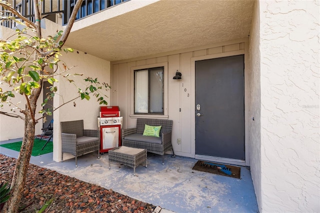 property entrance with a patio area