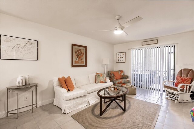 living room featuring light tile patterned floors and ceiling fan