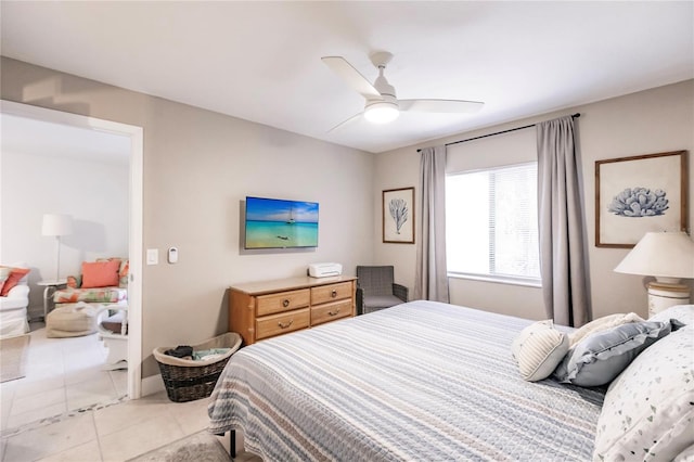 tiled bedroom with ceiling fan