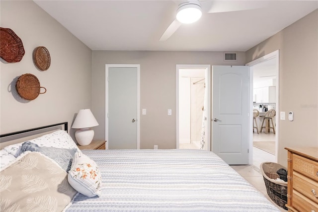 bedroom featuring light tile patterned flooring and ceiling fan