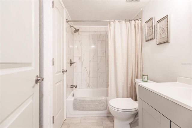 full bathroom featuring toilet, shower / bath combo with shower curtain, and vanity