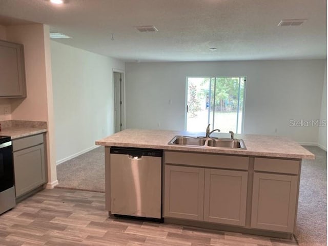 kitchen with dishwasher, light colored carpet, sink, and gray cabinetry