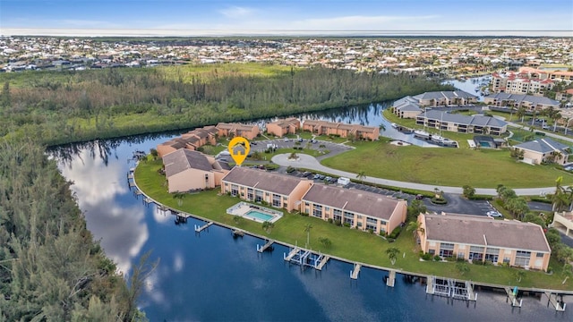 birds eye view of property with a water view