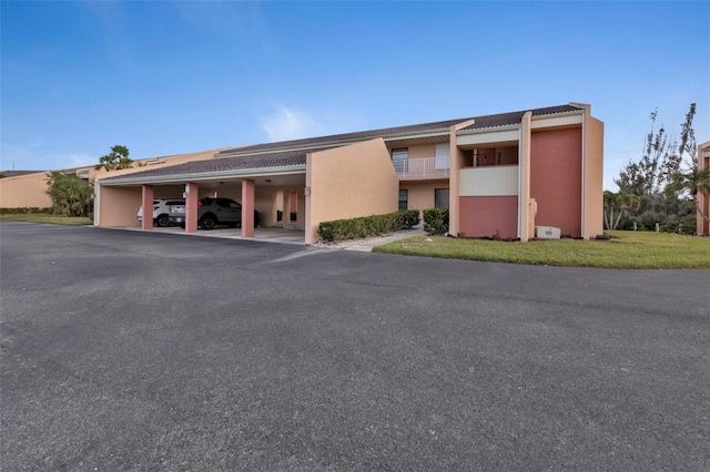 view of property featuring a carport