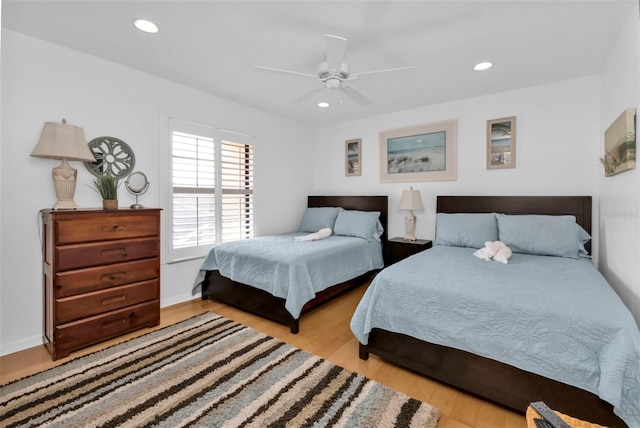 bedroom featuring light wood-type flooring and ceiling fan