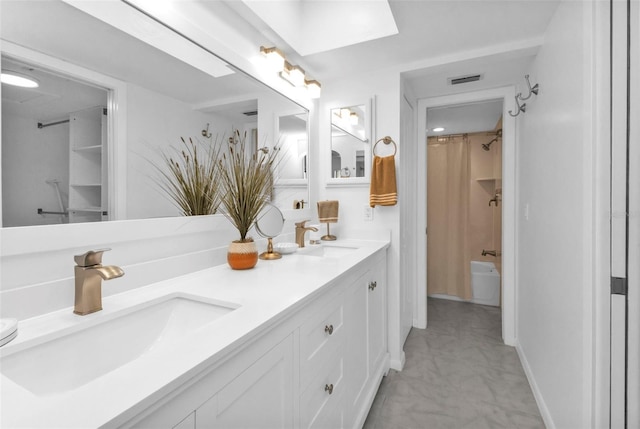 bathroom featuring shower / bath combination with curtain and vanity