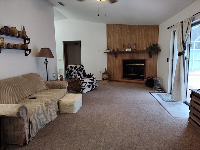 living room featuring vaulted ceiling, light colored carpet, and ceiling fan