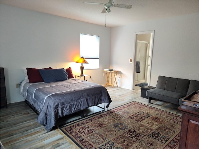 bedroom with wood-type flooring and ceiling fan